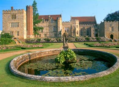 Medieval ancestral home of Viscount De L'Isle with historic gardens.