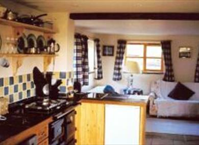Kitchen and lounge at Daisy's Cottage, Loudwater