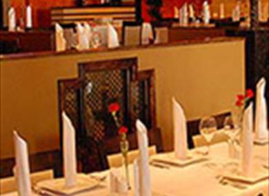 view of tables and bar