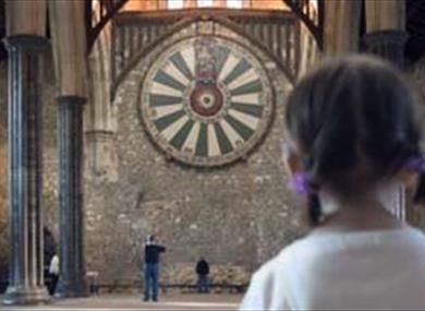 Young girl looking at the round table