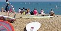 People enjoying Eastbourne Beach