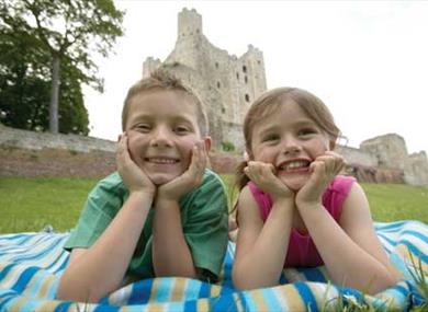 Photo of children in castle moat